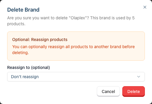 The Delete Brand dialog naming the product count, with the Optional: Reassign products panel and a Reassign to (optional) dropdown defaulting to