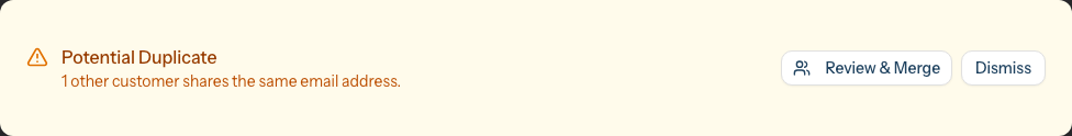 The amber Potential Duplicate panel on a customer profile, reading