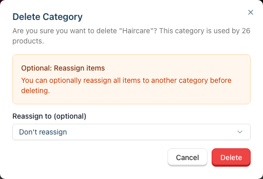 The Delete Category dialog for an in-use category, showing the optional Reassign to dropdown set to Don't reassign